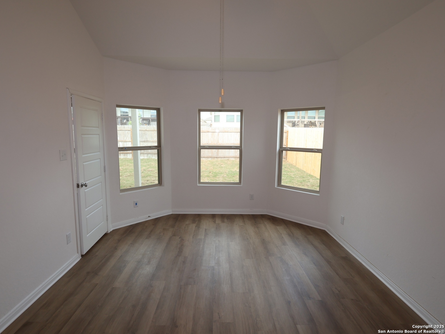 1164 Limestone Ridge Seguin, TX 78155 - Photo 5 of 45 an empty room with wooden floor and windows