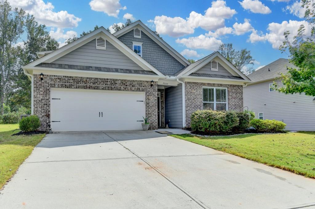 7535 Rambling Vale Dawsonville, GA 30534 - Photo 2 of 69 a front view of a house with garden