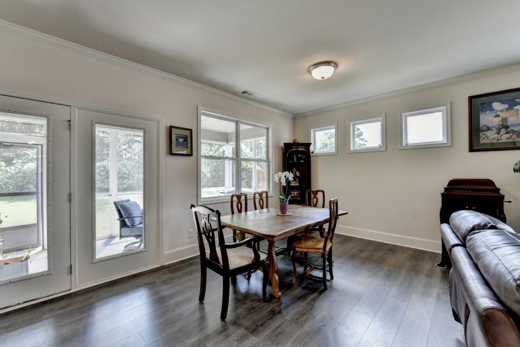 7535 Rambling Vale Dawsonville, GA 30534 - Photo 23 of 69 a view of a dining room with furniture and wooden floor