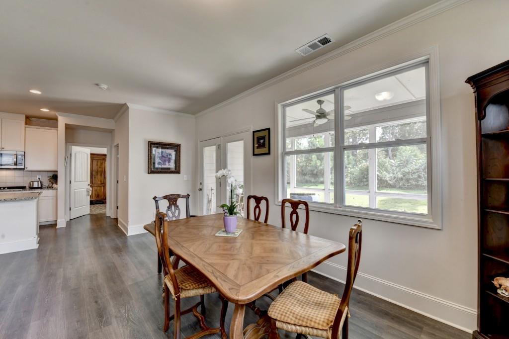 7535 Rambling Vale Dawsonville, GA 30534 - Photo 26 of 69 a view of a dining room with furniture window and wooden floor