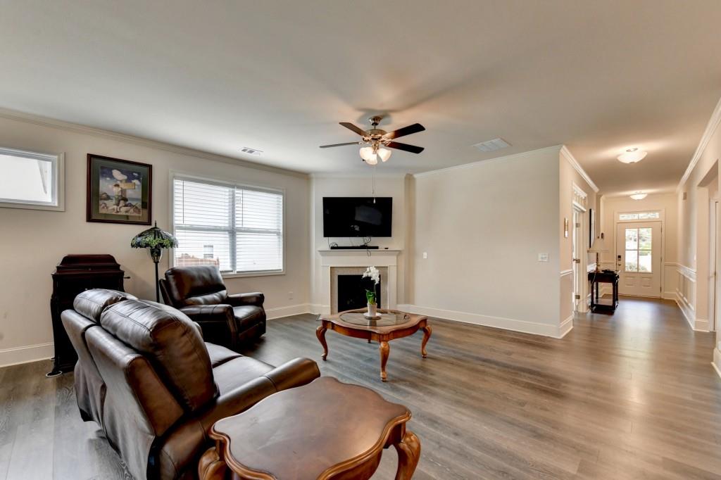 7535 Rambling Vale Dawsonville, GA 30534 - Photo 32 of 69 a living room with furniture and a flat screen tv