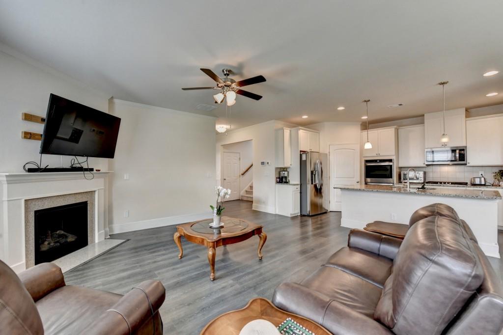 7535 Rambling Vale Dawsonville, GA 30534 - Photo 34 of 69 a living room with furniture and a fireplace