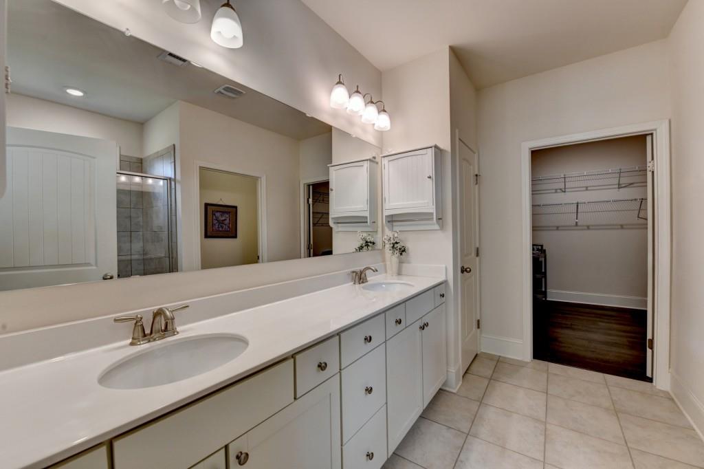 7535 Rambling Vale Dawsonville, GA 30534 - Photo 42 of 69 a bathroom with a sink double vanity and a shower