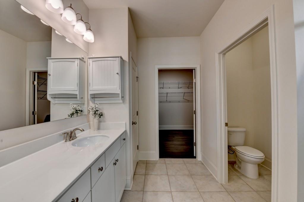 7535 Rambling Vale Dawsonville, GA 30534 - Photo 45 of 69 a bathroom with a sink a toilet and shower