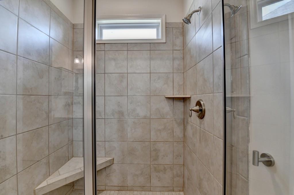 7535 Rambling Vale Dawsonville, GA 30534 - Photo 46 of 69 a bathroom with a glass shower door