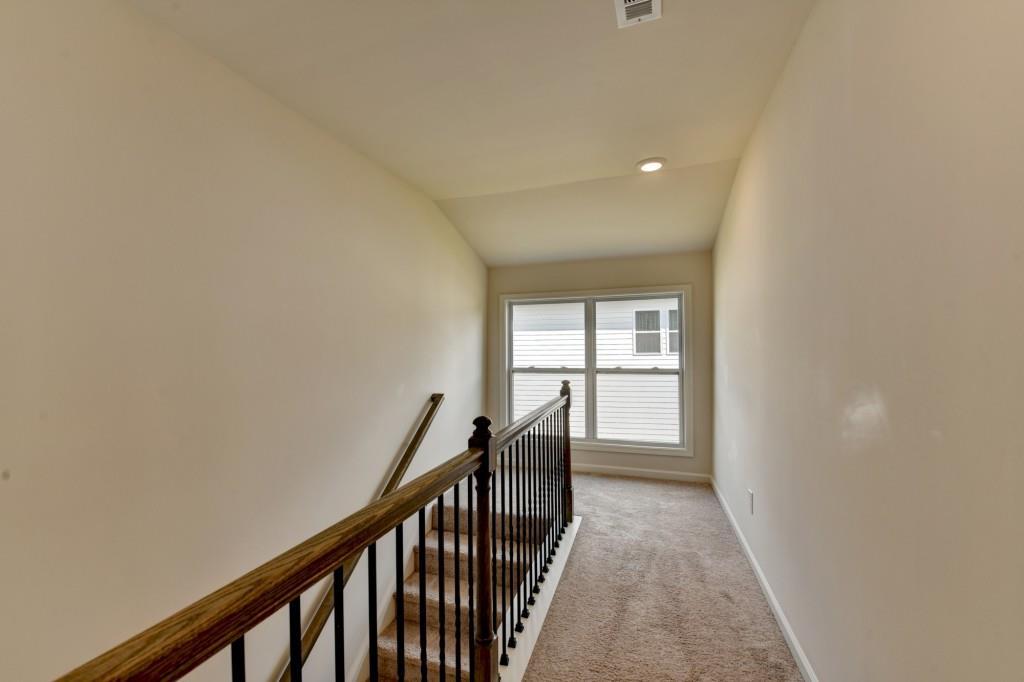 7535 Rambling Vale Dawsonville, GA 30534 - Photo 48 of 69 a view of a hallway with a window