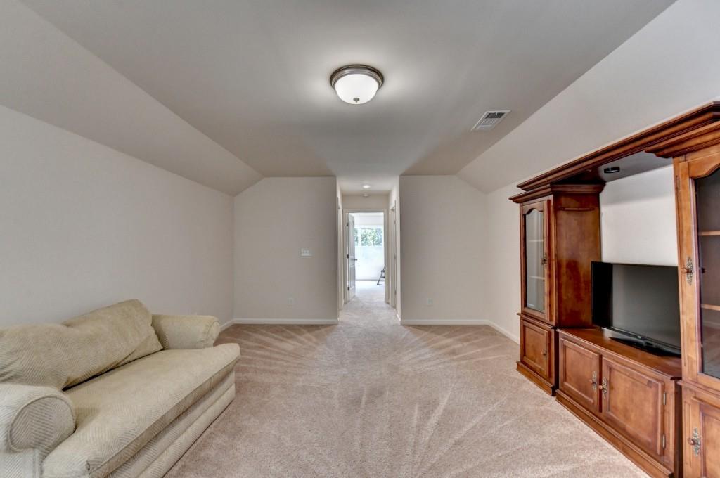 7535 Rambling Vale Dawsonville, GA 30534 - Photo 49 of 69 a living room with furniture and a flat screen tv