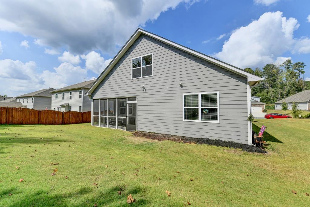 7535 Rambling Vale Dawsonville, GA 30534 - Photo 62 of 69 a front view of a house with a yard