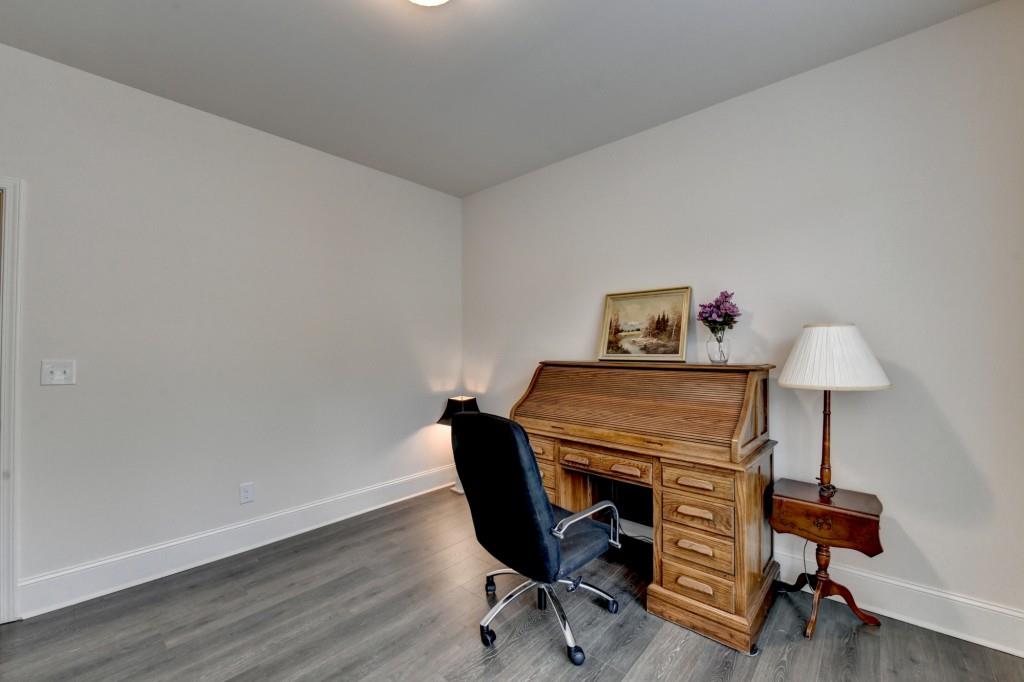 7535 Rambling Vale Dawsonville, GA 30534 - Photo 8 of 69 a workspace with furniture and a wooden floor