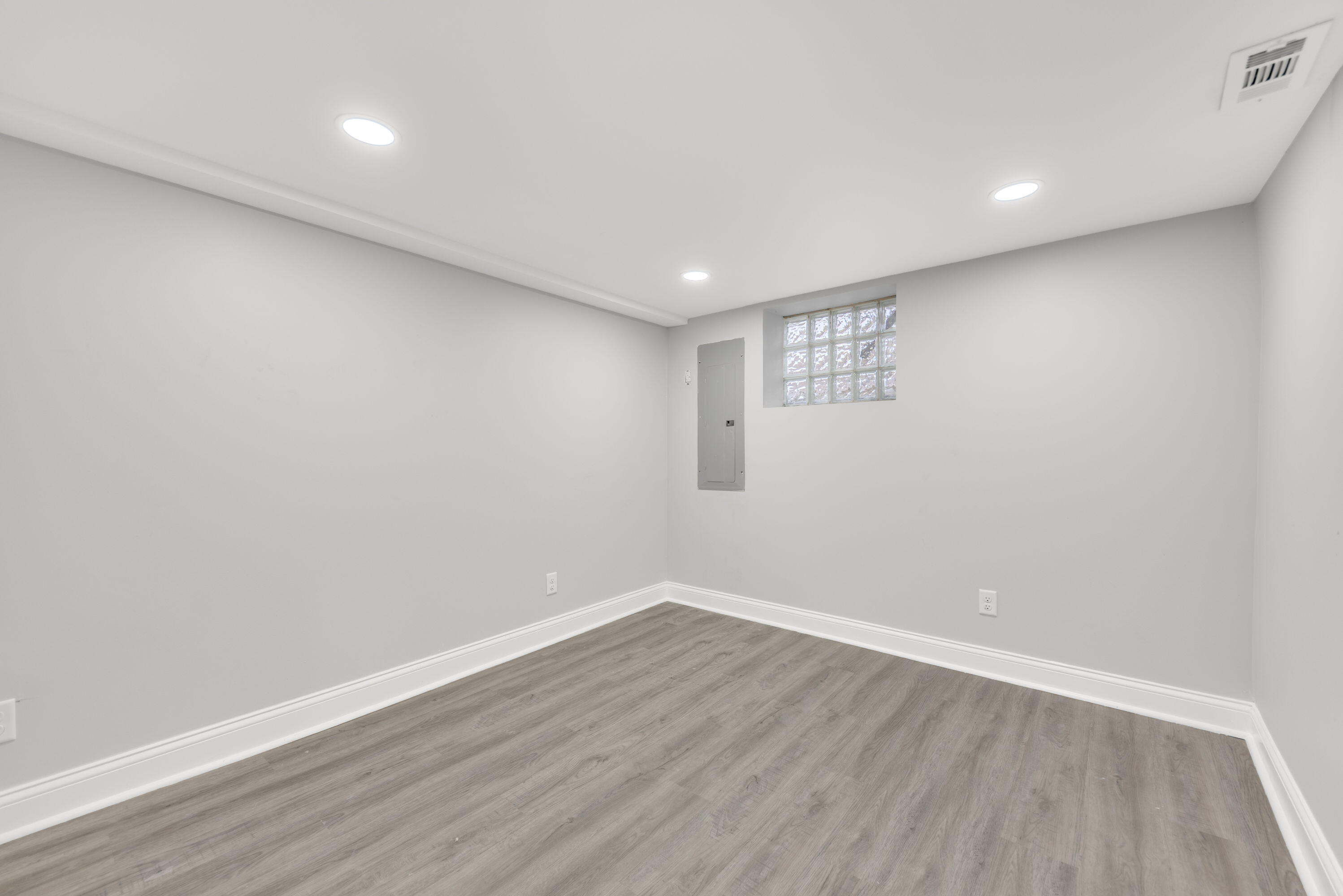 552 Harrison Street Gary, IN 46402 - Photo 12 of 14 a view of an empty room with wooden floor