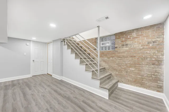 a view of entryway with wooden floor