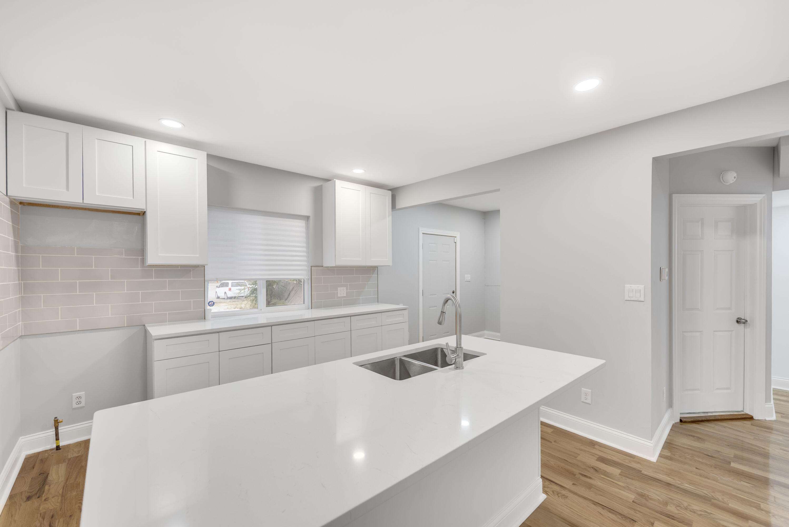 552 Harrison Street Gary, IN 46402 - Photo 4 of 14 a kitchen with a sink and a refrigerator