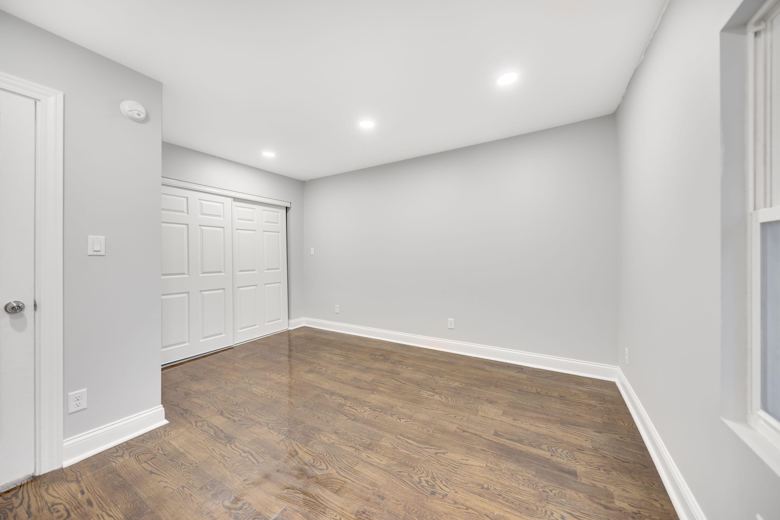 552 Harrison Street Gary, IN 46402 - Photo 10 of 14 wooden floor in an empty room with a window