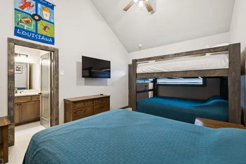 a bedroom with furniture and a chandelier