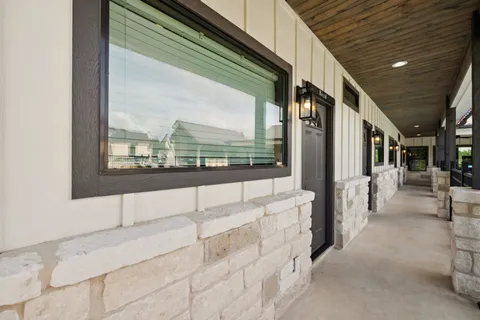 a view of a patio with table and chairs with wooden floor
