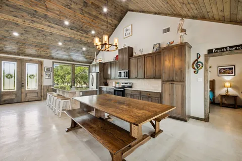 a kitchen with sink and refrigerator