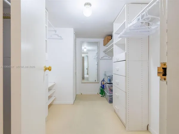 a living room with furniture flowerpot and a potted plant