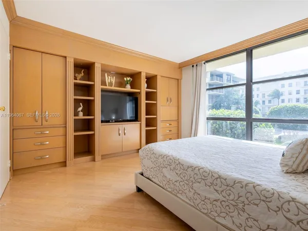 a view of storage and utility room with closet