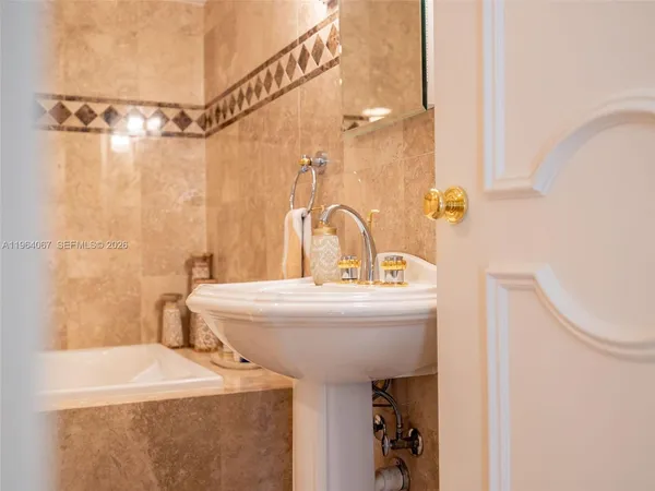 a balcony with furniture and a potted plant