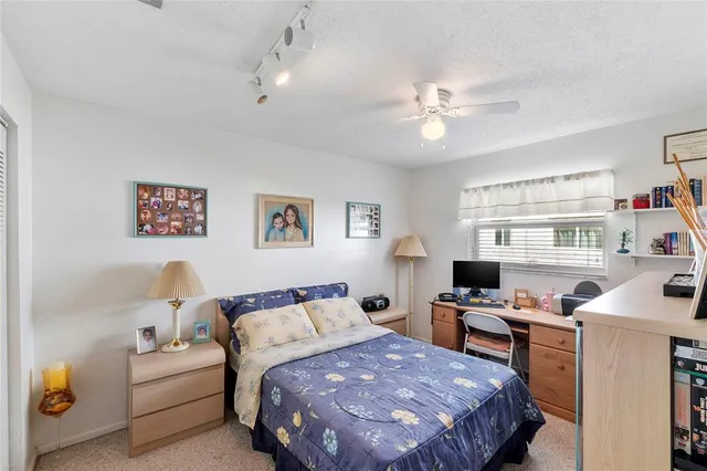 a bedroom with a bed furniture and a window