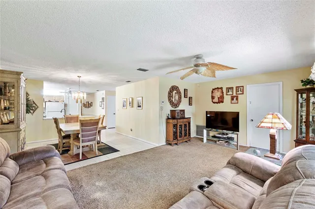a view of a livingroom with furniture and a flat screen tv
