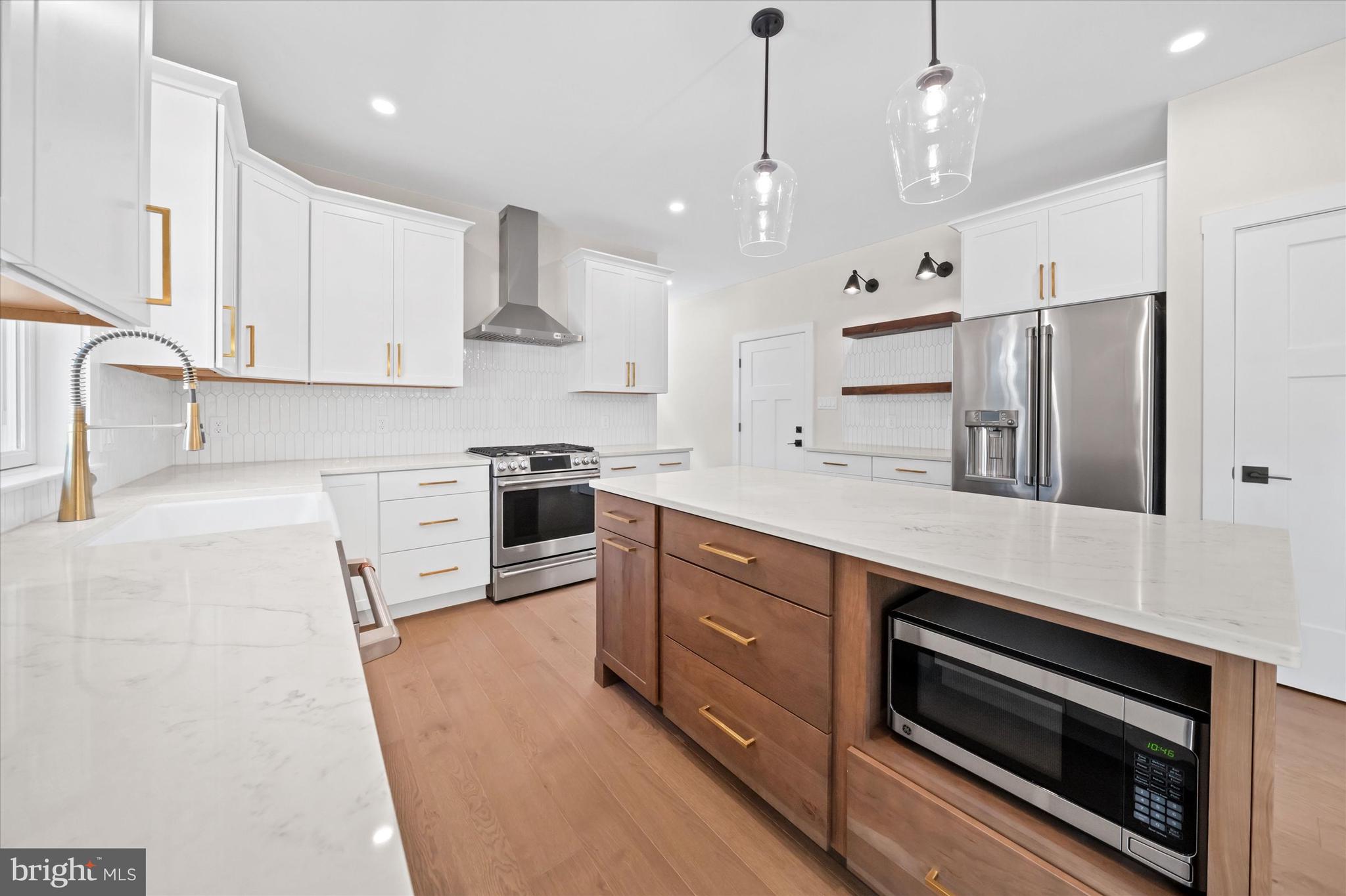 567 Southwood Road Hockessin, DE 19707 - Photo 14 of 54 a large kitchen with stainless steel appliances granite countertop a stove a sink and a refrigerator