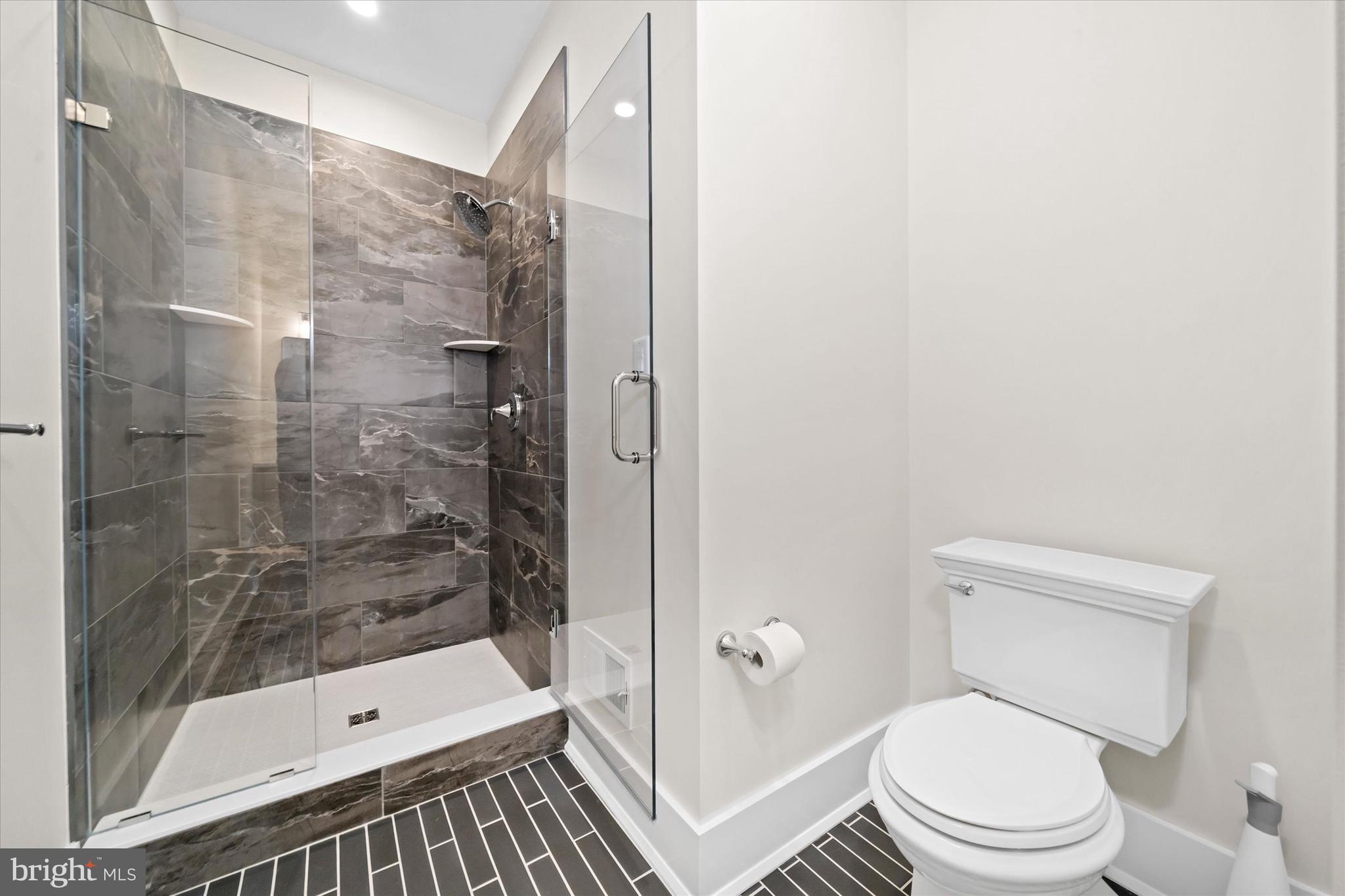 567 Southwood Road Hockessin, DE 19707 - Photo 25 of 54 a bathroom with a shower and a toilet