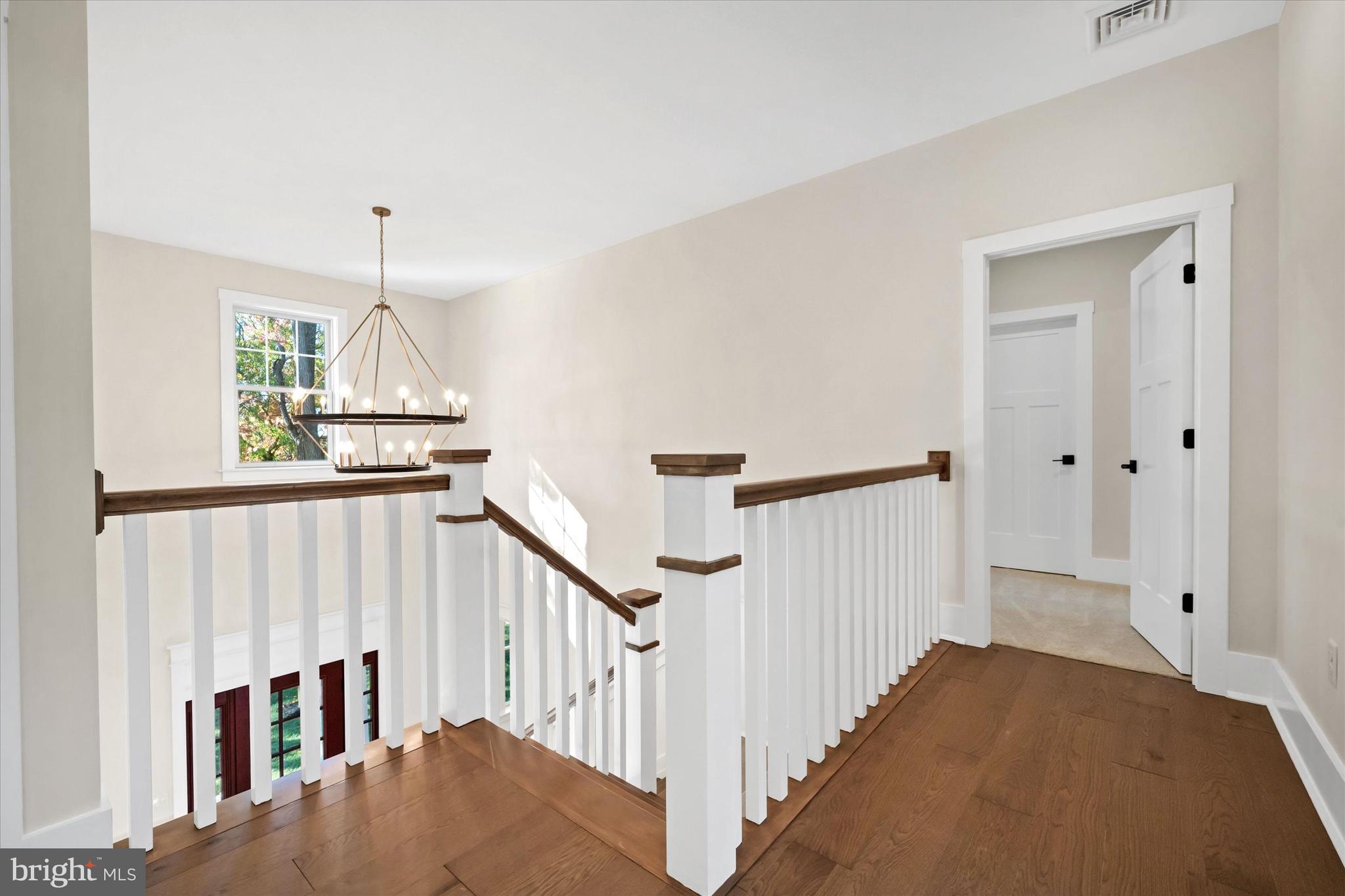 567 Southwood Road Hockessin, DE 19707 - Photo 29 of 54 a view of staircase with lots of frames on wall and wooden floor
