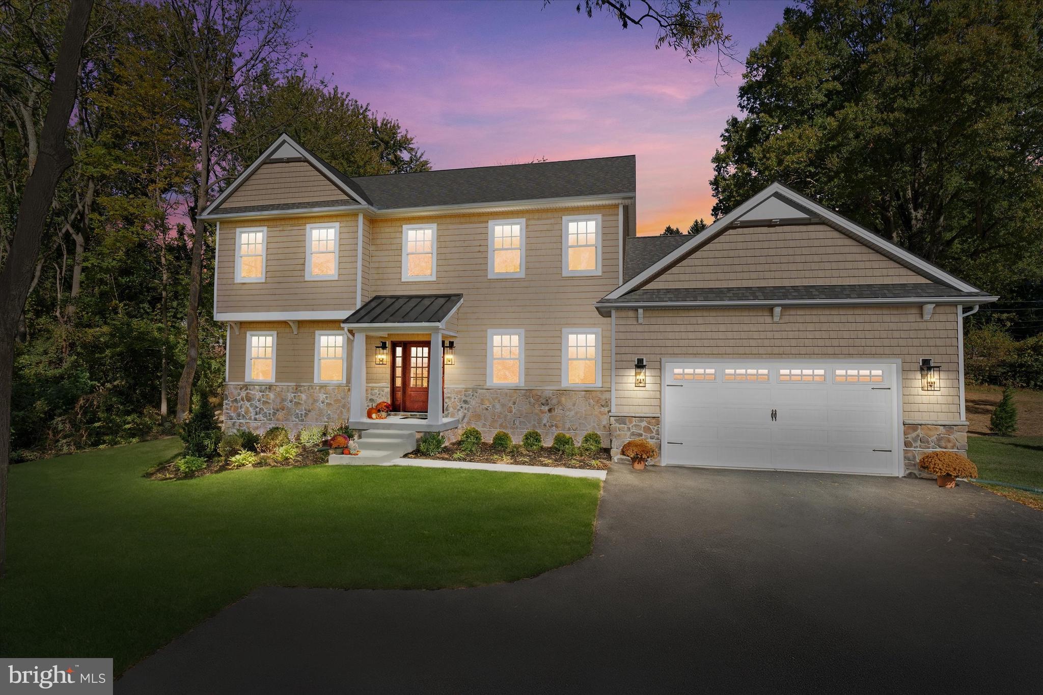 567 Southwood Road Hockessin, DE 19707 - Photo 50 of 54 a front view of a house with a yard and garage
