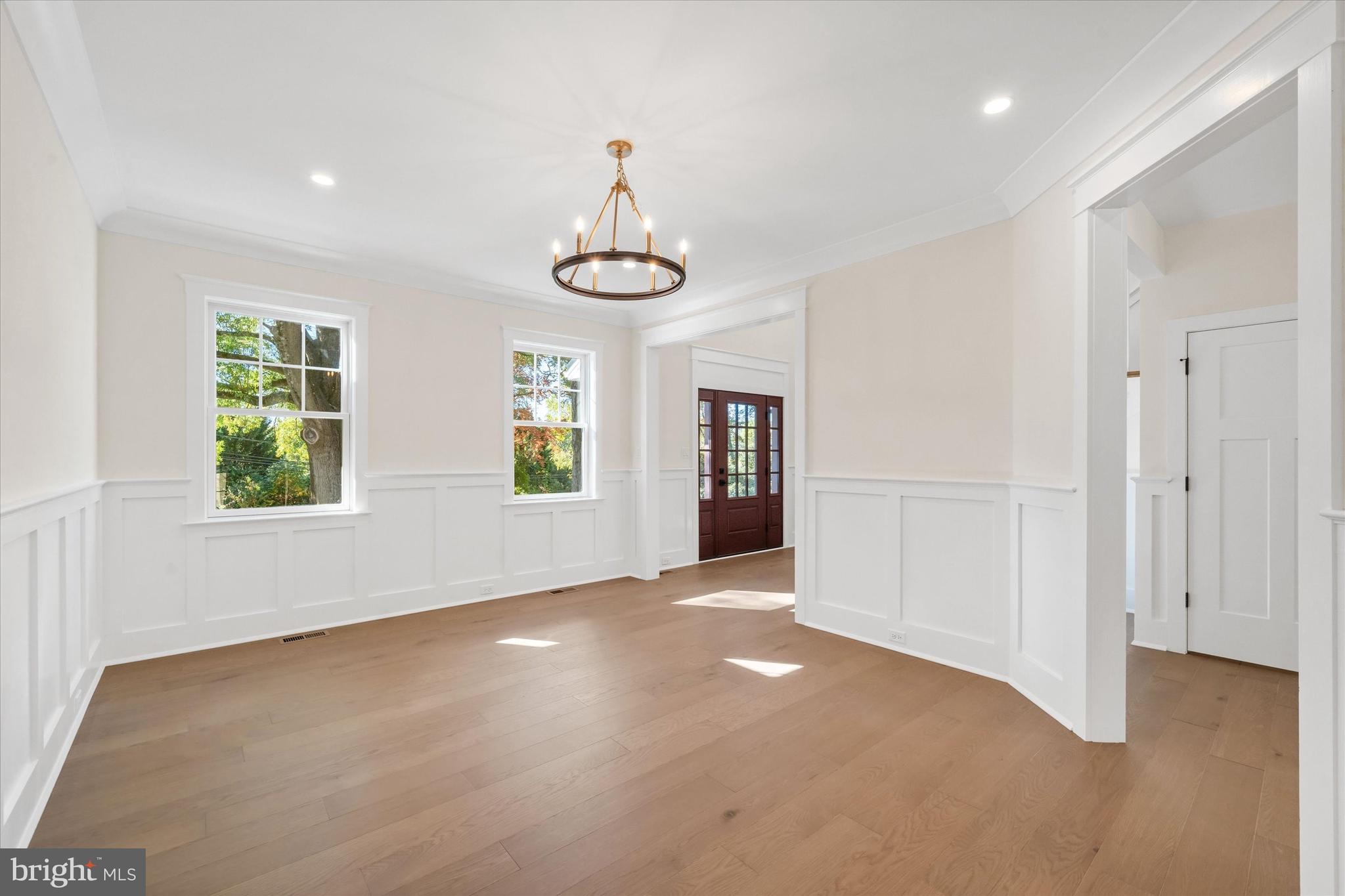 567 Southwood Road Hockessin, DE 19707 - Photo 8 of 54 a view of an empty room with window and wooden floor