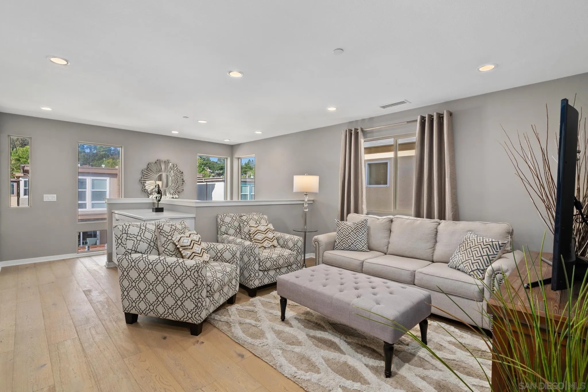 8347 Ridge Court San Diego, CA 92108 - Photo 17 of 63 a living room with furniture and a flat screen tv