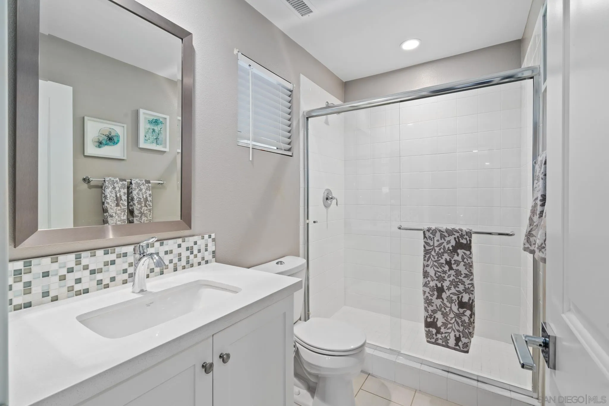 8347 Ridge Court San Diego, CA 92108 - Photo 20 of 63 a bathroom with a sink toilet and shower