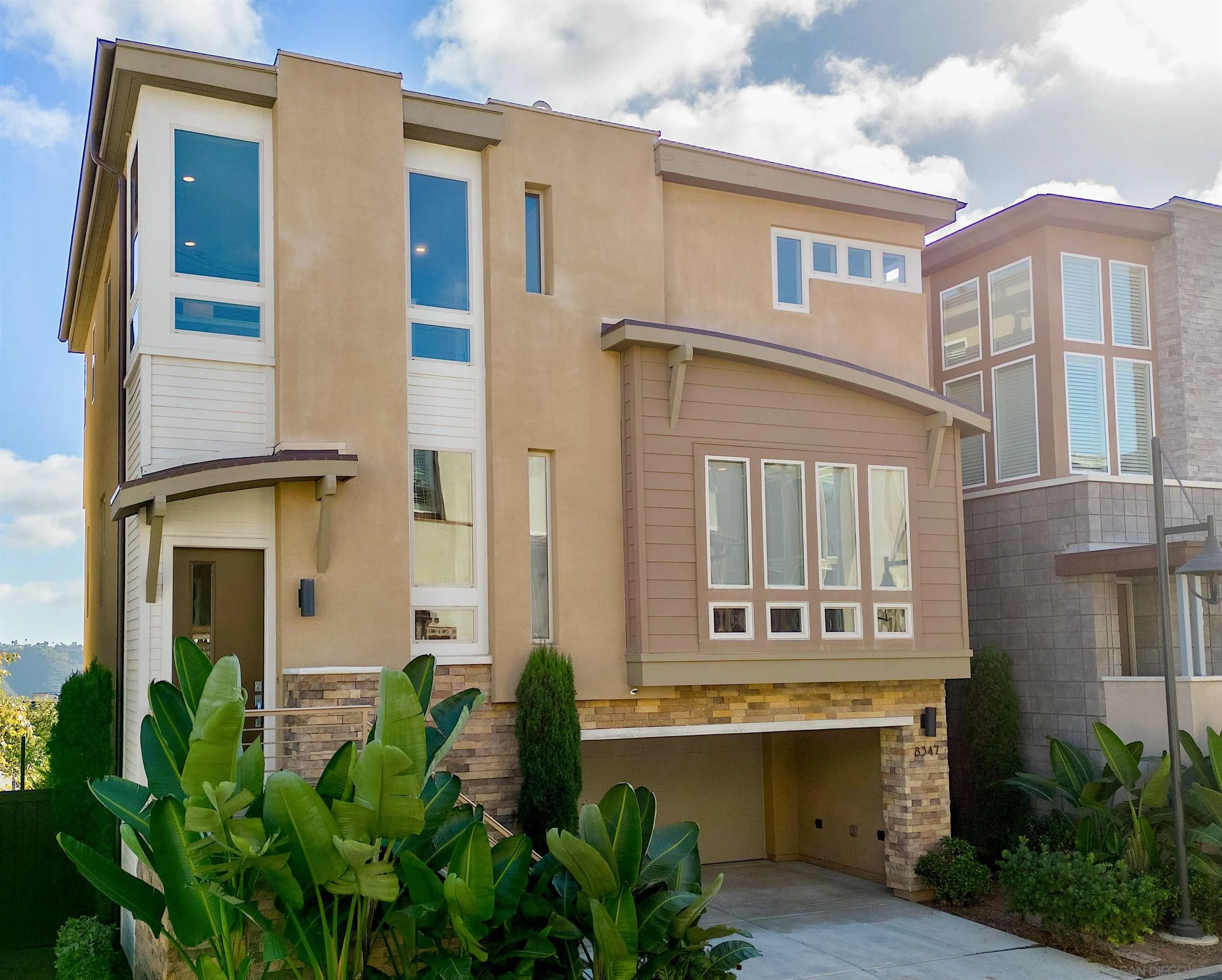 8347 Ridge Court San Diego, CA 92108 - Photo 2 of 63 a front view of a house with a yard