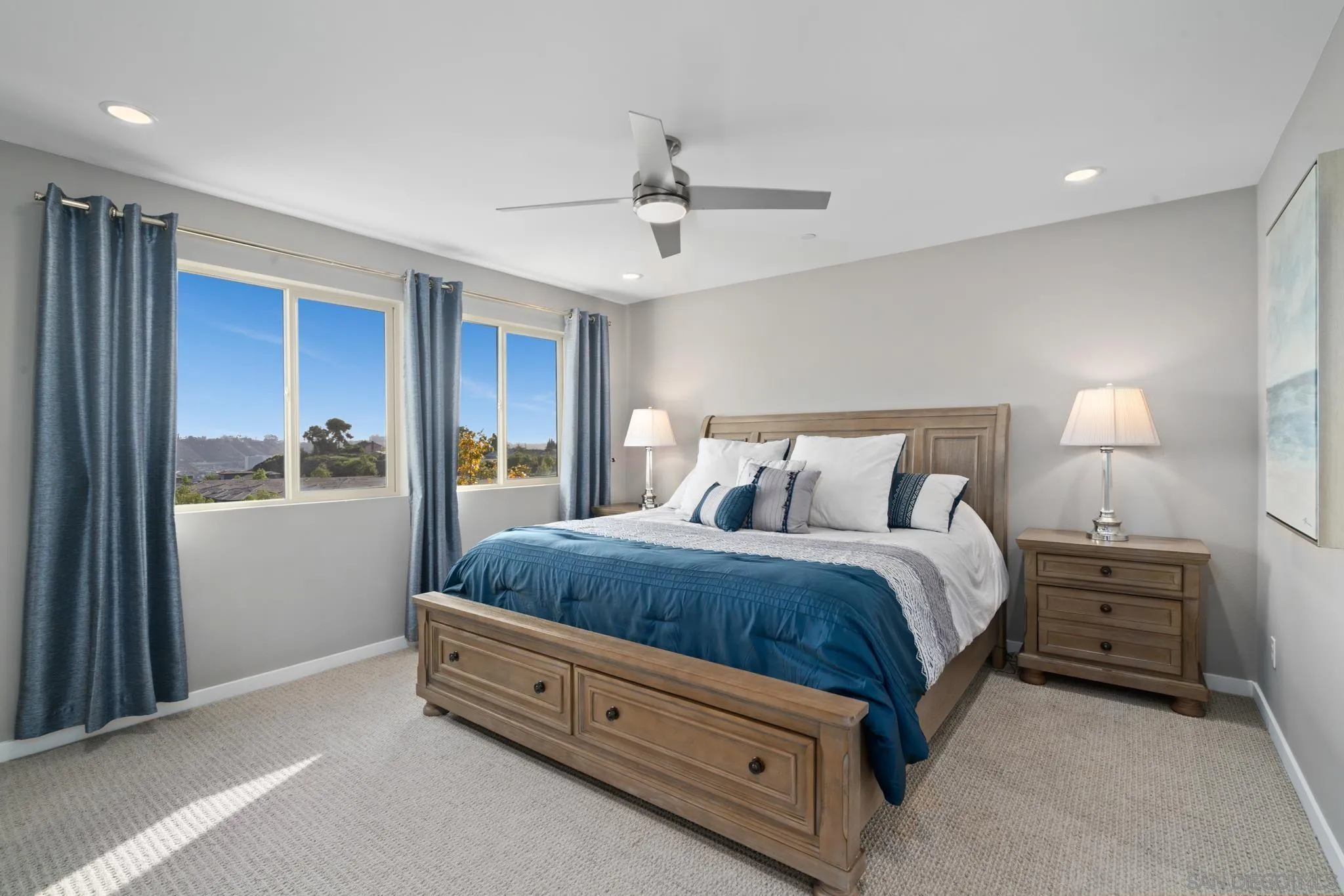 8347 Ridge Court San Diego, CA 92108 - Photo 21 of 63 a spacious bedroom with a bed and a window