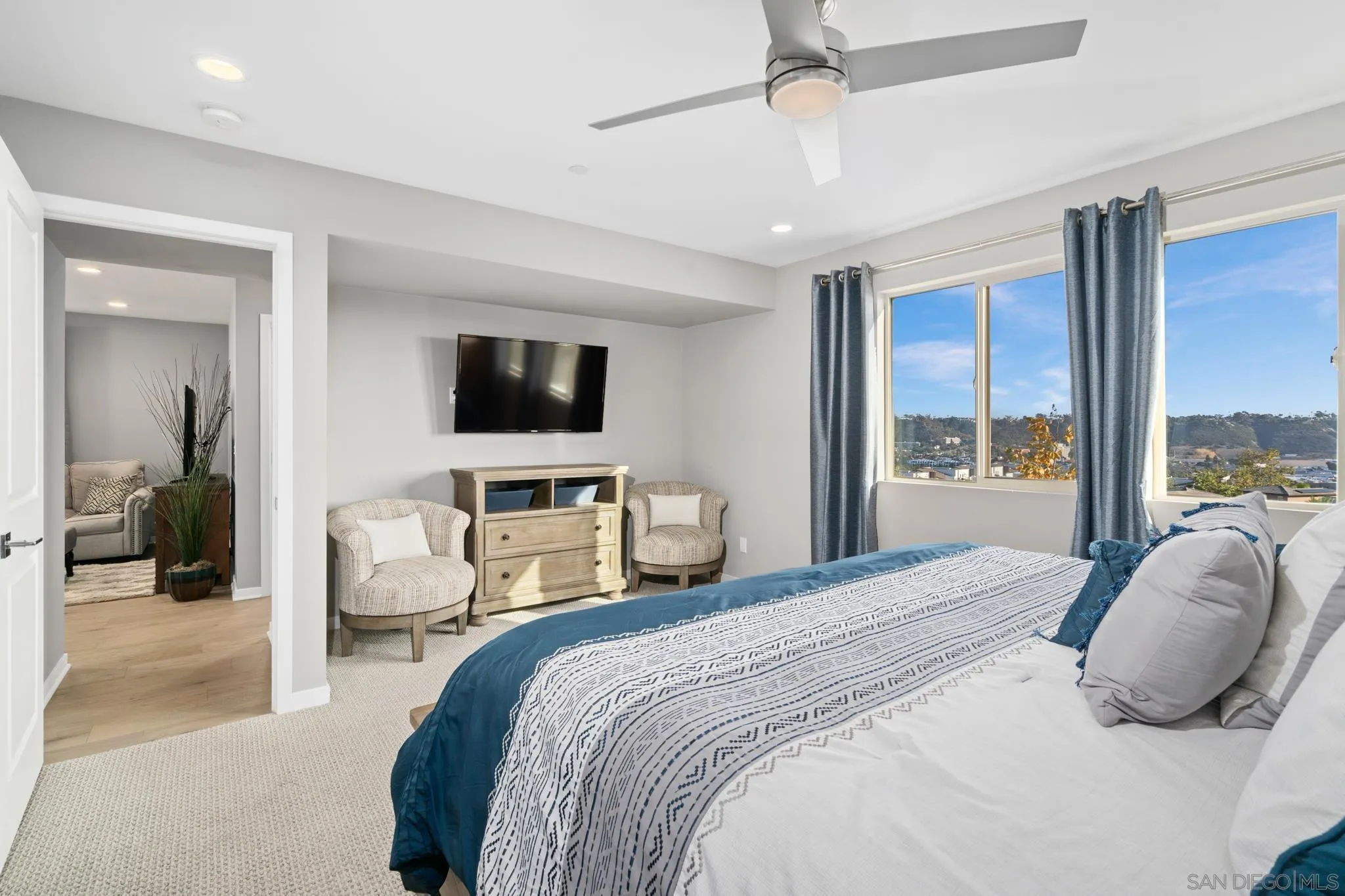8347 Ridge Court San Diego, CA 92108 - Photo 22 of 63 a bedroom with a bed and a flat screen tv