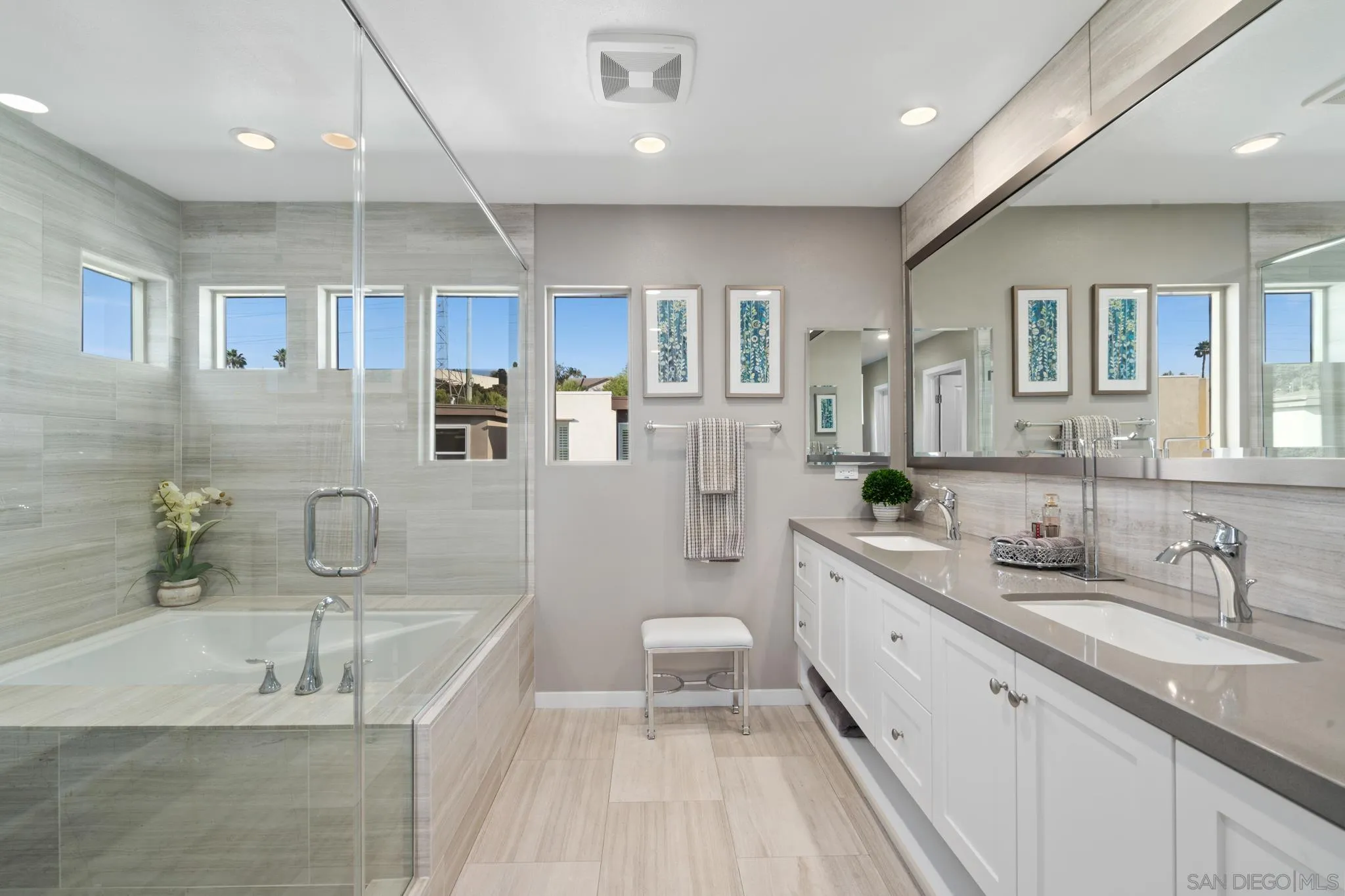 8347 Ridge Court San Diego, CA 92108 - Photo 23 of 63 a spacious bathroom with a granite countertop sink mirror and bathtub