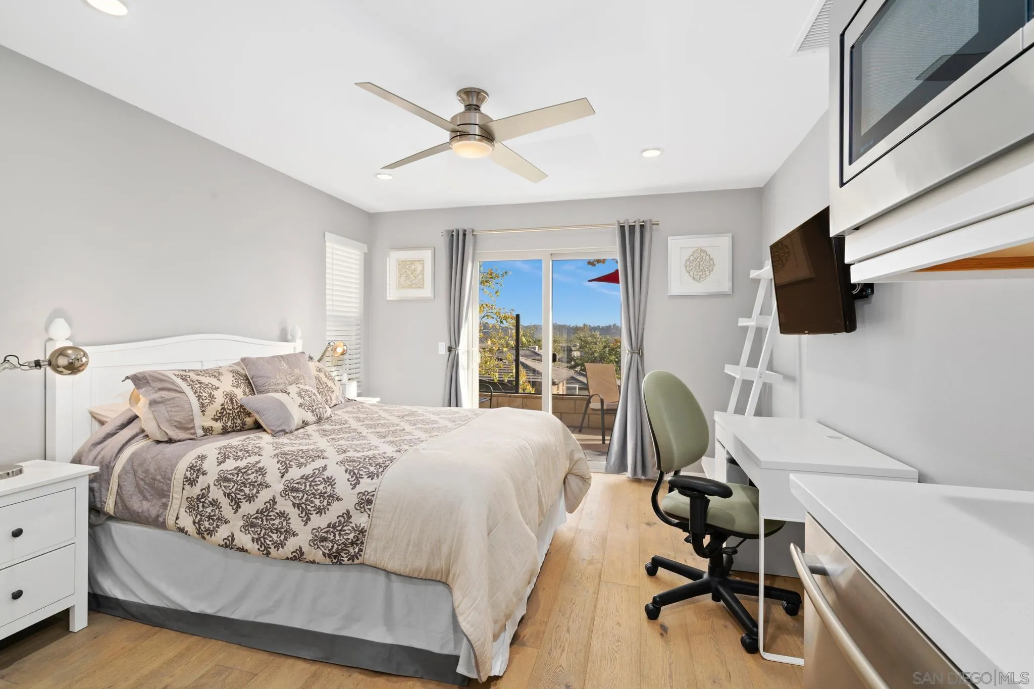 8347 Ridge Court San Diego, CA 92108 - Photo 27 of 63 a bedroom with a bed and a flat screen tv