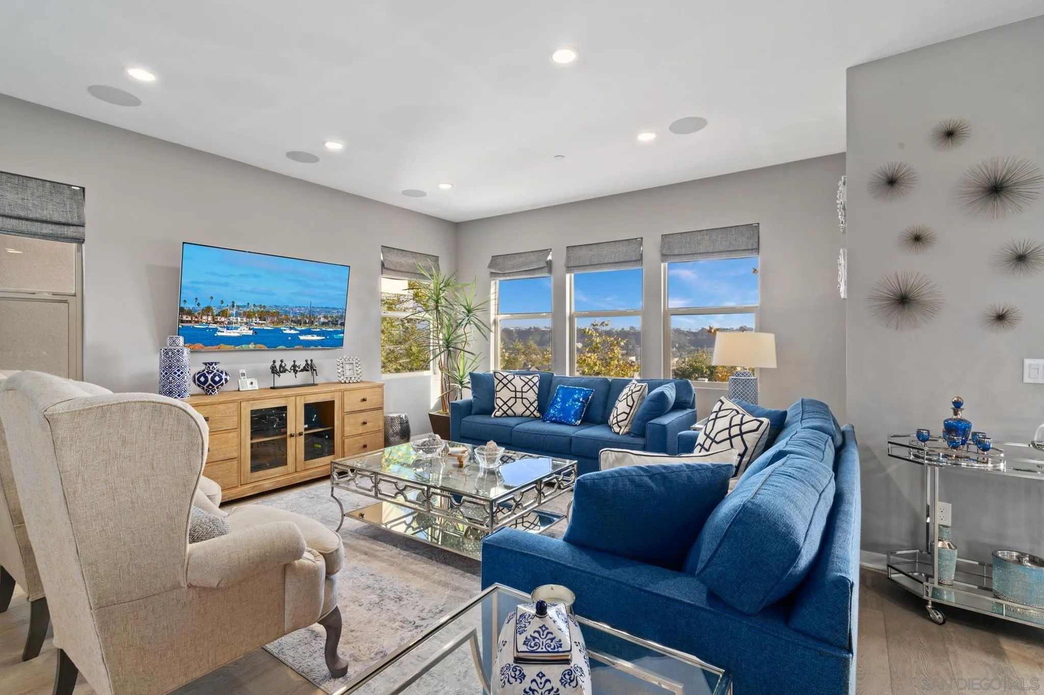 8347 Ridge Court San Diego, CA 92108 - Photo 4 of 63 a living room with furniture flat screen tv and a fireplace