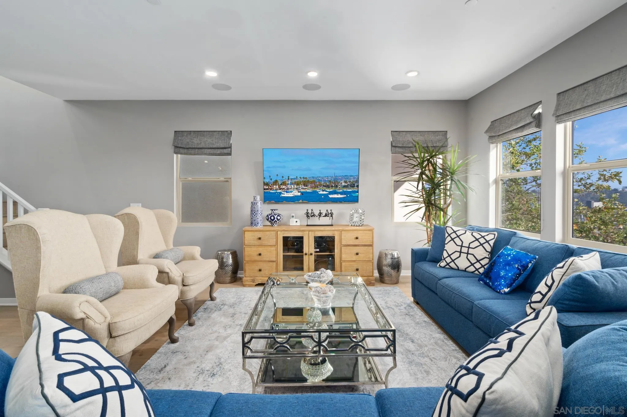 8347 Ridge Court San Diego, CA 92108 - Photo 5 of 63 a living room with furniture a rug potted plant and a large window