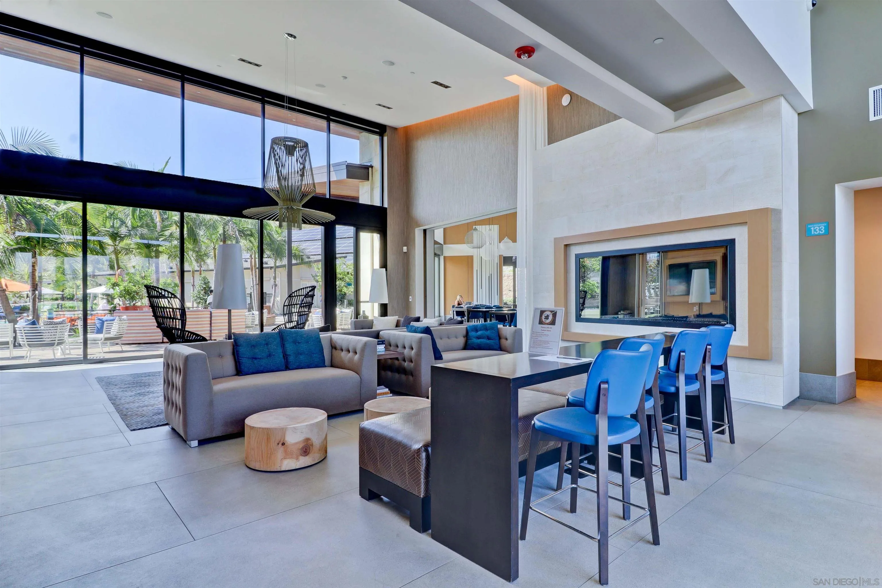 8347 Ridge Court San Diego, CA 92108 - Photo 56 of 63 a living room with furniture a fireplace and a large window