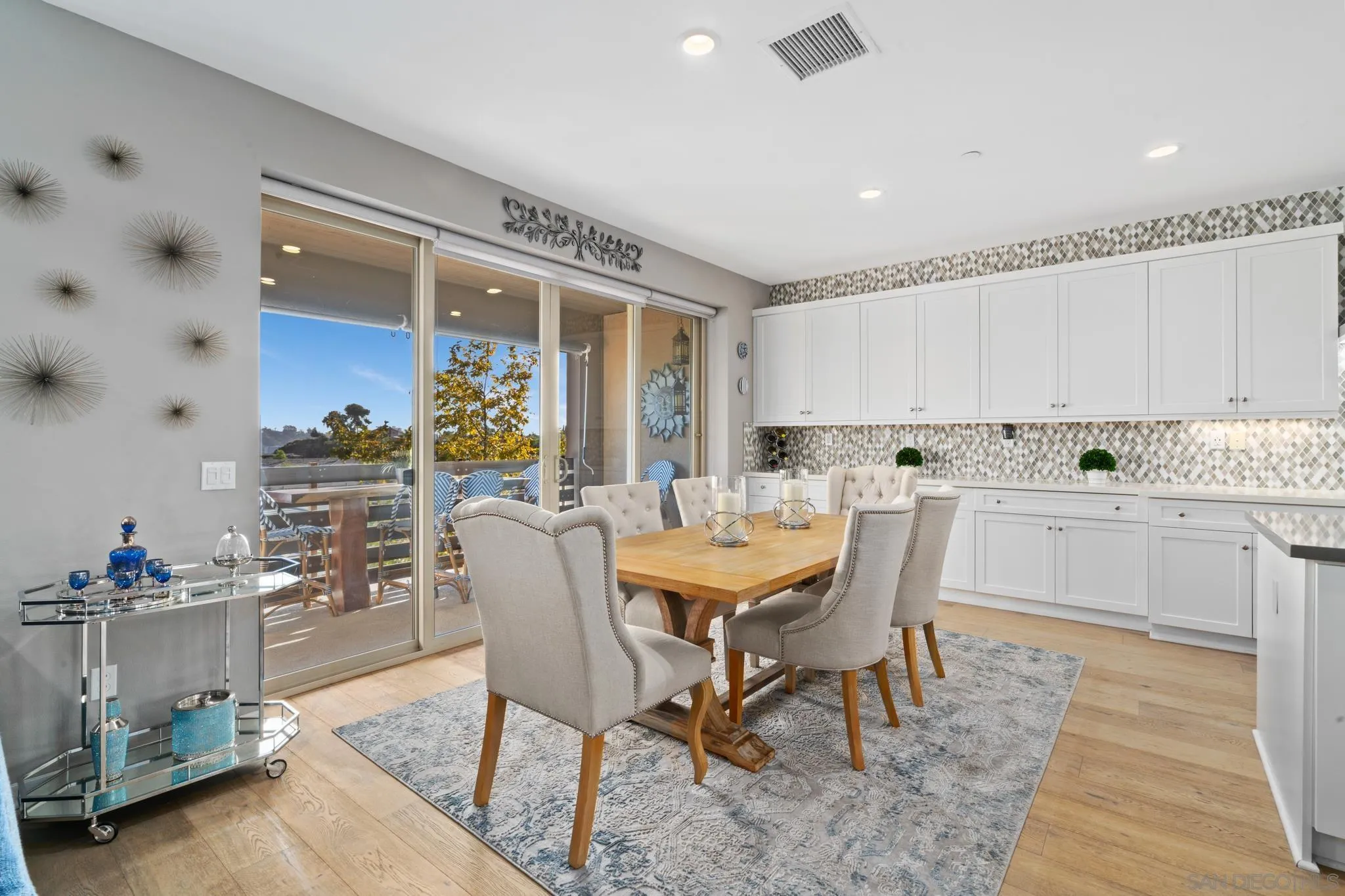 8347 Ridge Court San Diego, CA 92108 - Photo 10 of 63 a view of a dining room with furniture and chandelier