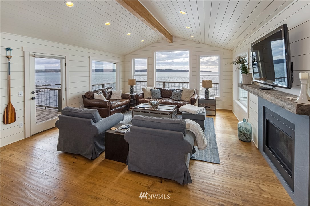 3051 Pear Point Road Friday Harbor, WA 98250 - Photo 12 of 39 a living room with furniture and a flat screen tv