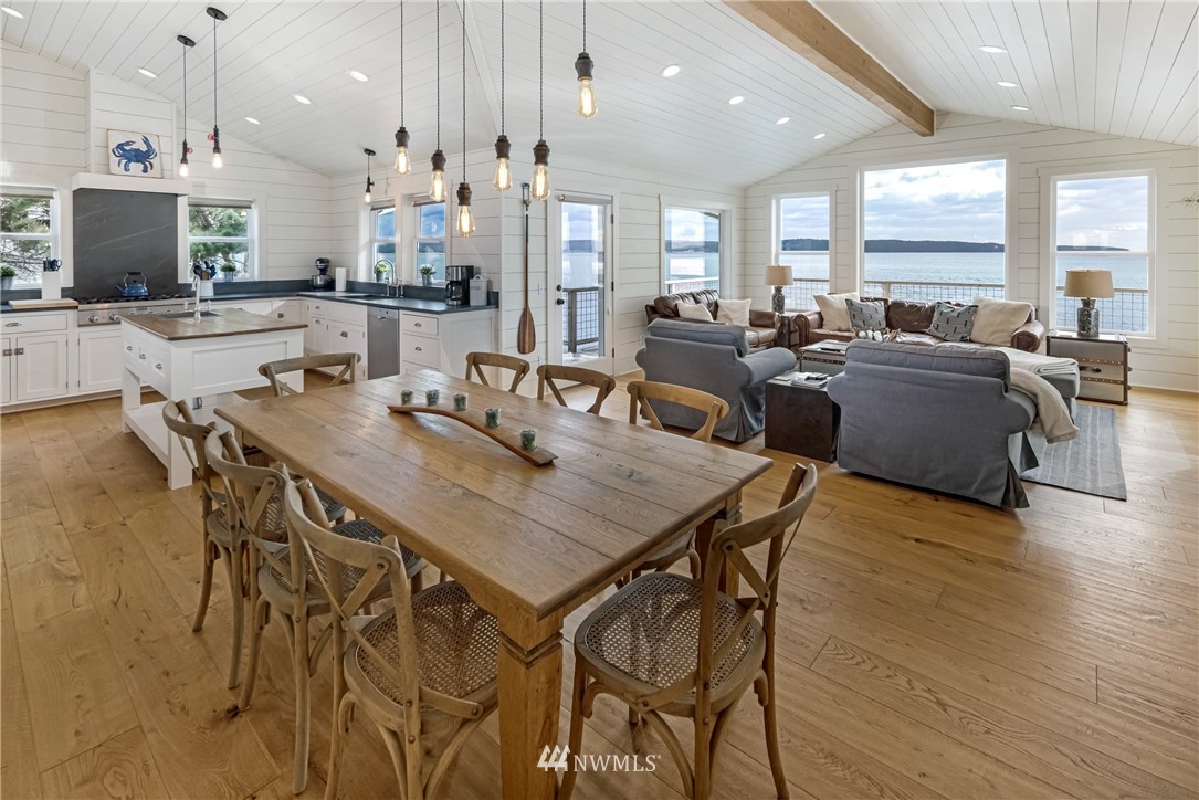 3051 Pear Point Road Friday Harbor, WA 98250 - Photo 15 of 39 a view of a dining area with furniture and wooden floor