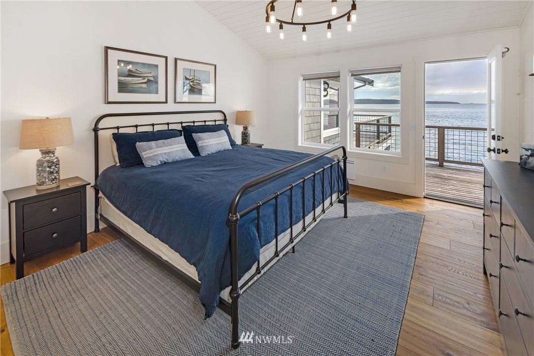 3051 Pear Point Road Friday Harbor, WA 98250 - Photo 18 of 39 a bedroom with a bed and wooden floor