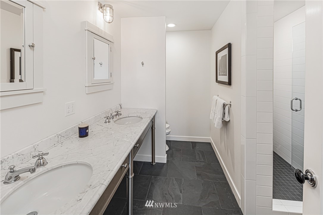 3051 Pear Point Road Friday Harbor, WA 98250 - Photo 21 of 39 a bathroom with double vanity sink and a mirror