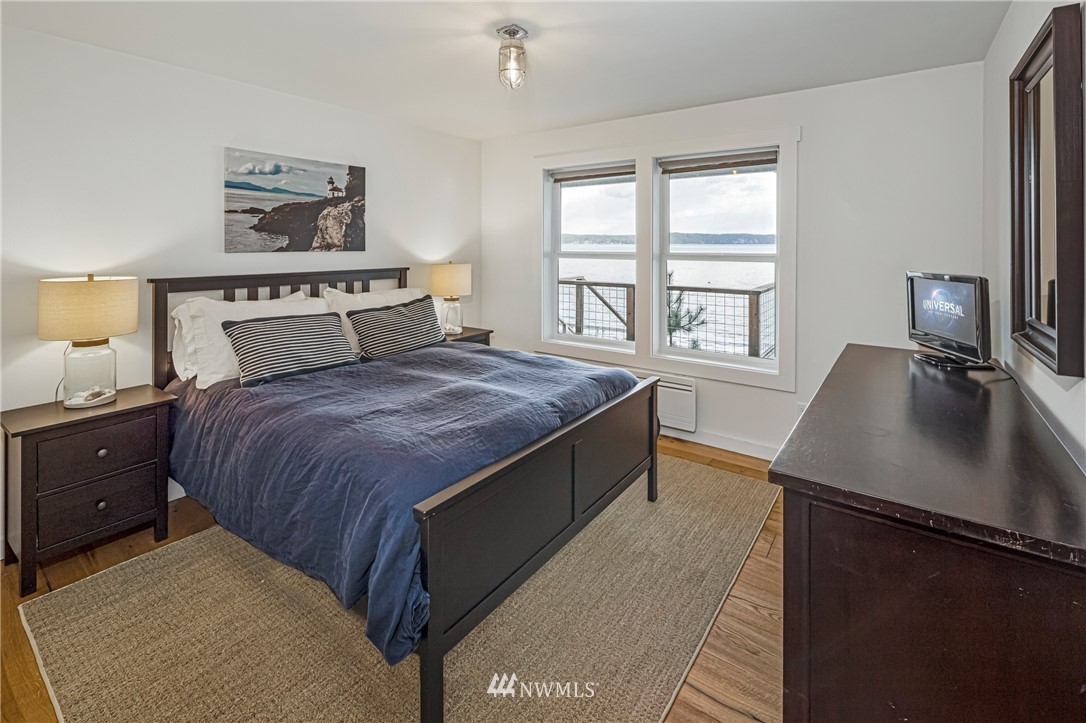 3051 Pear Point Road Friday Harbor, WA 98250 - Photo 23 of 39 a bed room with a bed and a chair