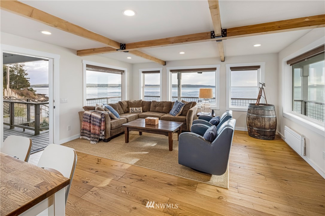 3051 Pear Point Road Friday Harbor, WA 98250 - Photo 24 of 39 a living room with furniture and a large window