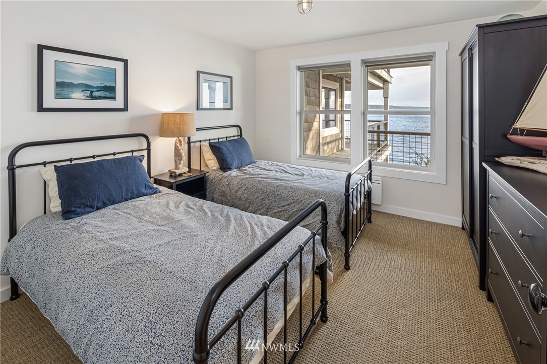 3051 Pear Point Road Friday Harbor, WA 98250 - Photo 27 of 39 a bedroom with two beds and a window