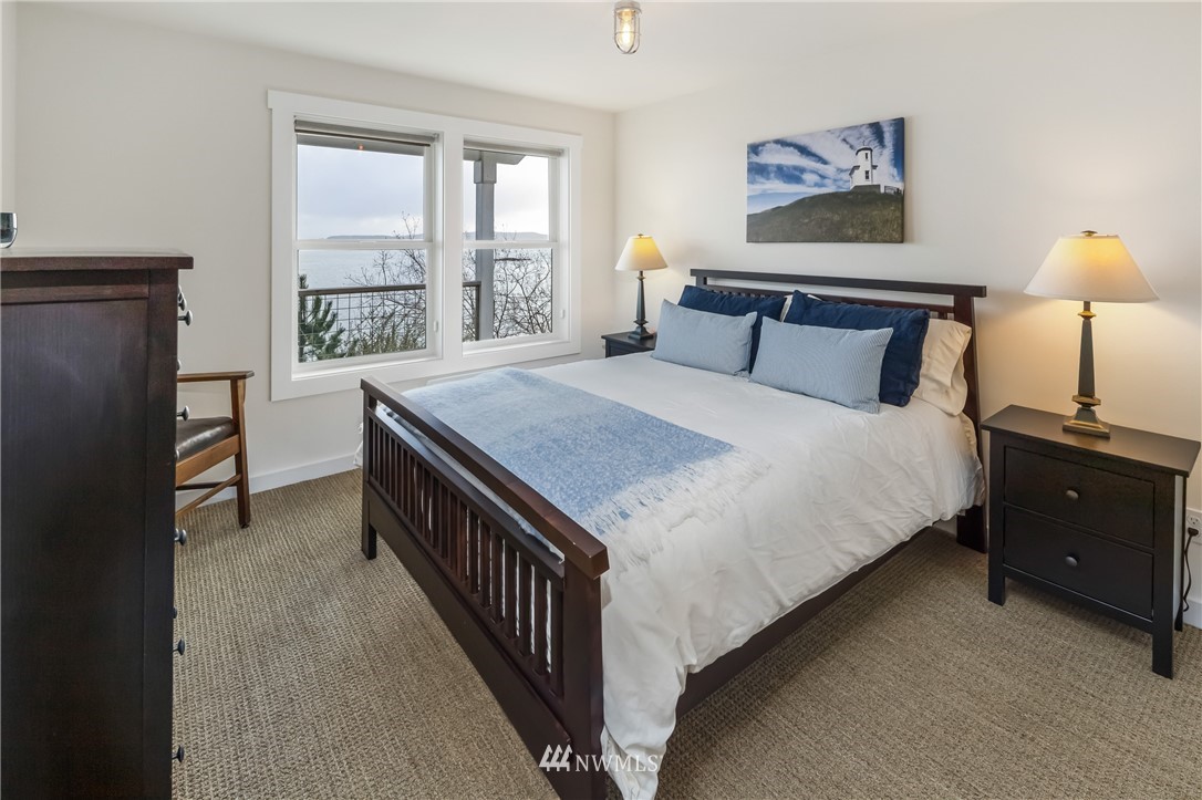 3051 Pear Point Road Friday Harbor, WA 98250 - Photo 28 of 39 a bedroom with a bed and a window