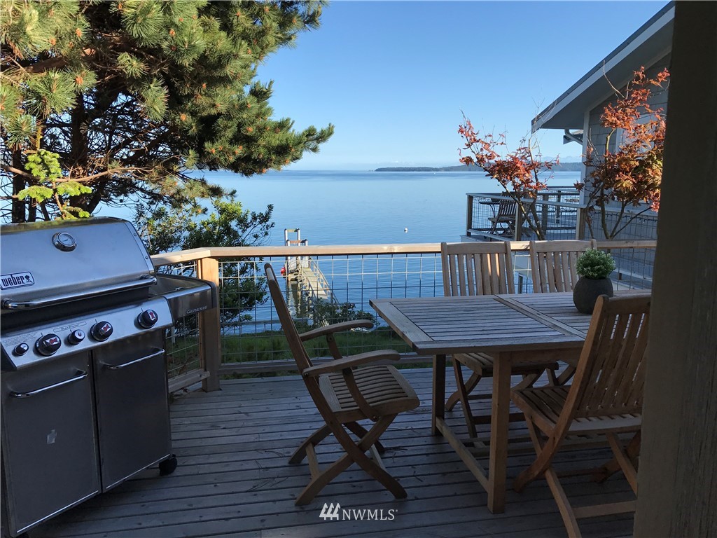 3051 Pear Point Road Friday Harbor, WA 98250 - Photo 34 of 39 a view of a dining room with furniture and wooden floor